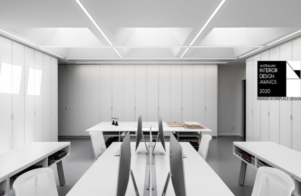 Warwick Creative Studio workplace design in Melbourne with white interiors, pin-board cupboard doors, plenty of natural lighting from skylights to promote wellness.